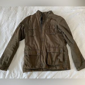Hurley military style jacket. Fleece lined. Nylon hood hidden in zipped collar.